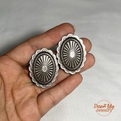 We guarantee this to be an authentic Native American made earrings. Your satisfaction is 100% guaranteed. ➳ M E A S U R E M E N T S ⌾ Earring Motif: 1¼" W x 1½" H ⌾ 10.1 grams ➳ M A T E R I A L S ⌾ Sterling Silver ➳ D E S C R I P T I O N  This is a pair of exquisite vintage Navajo ear clips of a beautiful concho pattern that consists of intricate sun patterns with reposed shells with a domed center. Rising sun stamp pattern around a scalloped perimeter.  Sterling silver, not marked. Cir. Mid century. A classic bohemian western design. ➳ O N E ∙ O F ∙ A ∙ K I N D Please note all of our jewelries are vintage and made with real stones and precious metals. We test all of our jewelry with acid to ensure that they are made with genuine sterling silver. Some pieces may have minor flaws or irregul Silver Concho Earrings For Gift, Silver Concho Earrings As A Gift, Decorative Silver Earrings As Gift, Elegant Silver Concho Earrings, Elegant Concho Earrings For Gift, Artisan Concho Earrings As Gift, Southwestern Oval Earrings As Gift, Southwestern Oval Earrings For Gift, Silver Western Style Earrings