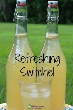 two bottles of refreshing switchel sitting on a table