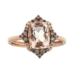 a ring with an morganite and brown diamonds