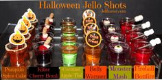 halloween jello shots are lined up on a table