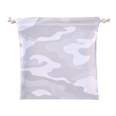 a white and grey camouflage print bag with rope handles on the front, hanging from a string