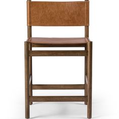 a wooden chair with leather seat and back rests on a white background, the image is in full color