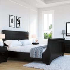 a bed room with a neatly made bed and two night stands