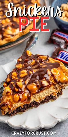 a slice of snickkers pie on a white plate with chocolate and caramel