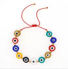 Multicolor Round evil Eye Bracelet. Adjustable red cord Red Jewelry With Adjustable Length And Round Beads, Hand-strung Red Wristband Bracelet, Adjustable Red Evil Eye Bracelet Hand-strung, Adjustable Red Evil Eye Bracelet, Hand-strung, Adjustable Hand-strung Red Wristband, Red Spiritual Bracelet With Adjustable Length, Red Jewelry With Adjustable Cord And Round Beads, Red Spiritual Jewelry With Adjustable Cord, Red Resizable Bracelet