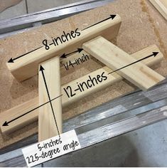 an image of wooden frames with measurements on them