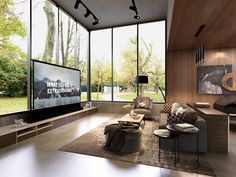 a living room filled with furniture and large windows