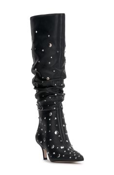 Glossy studs and a slouchy shaft create an edgy aesthetic on a leather knee-high boot balanced by a pointy toe and tapered heel. 2 1/4" heel 16 3/4" shaft; 16 1/2" calf circumference. Wide calf Pull-on style Leather upper/synthetic lining/rubber sole Imported Studded Knee-high Party Boots, Knee-high Studded Boots For Party, Studded Fitted Heeled Boots For Night Out, Fitted Studded Heeled Boots For Night Out, Fall Night Out Boots With Rivets, Studded Heeled Boots For Night Out In Winter, Edgy Aesthetic, Knee High Leather Boots, Wide Calf