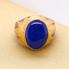 Lapis Lazuli, Large, Oval 24K Gold and Silver Textured Cocktail Ring, Handmade by Prehistoric Works of Istanbul, Turkey, elkandhammer Don't know your size? Order a ring sizer here: https://www.etsy.com/listing/128895124/multi-sizer-adjustable-finger-gauge-ring Size 7 1/2 (only), this item is not made to order 24K Gold - 1.55 grams Sterling 925 - 7 grams Lapis - 7.5 ct Traditional Oval Signet Ring With Polished Finish, Luxury Handmade Oval Cabochon Ring, Handmade Oval Luxury Signet Ring, Handmade Oval Signet Ring For Collectors, Handmade Oval Signet Ring As Collectible, Handmade Yellow Gold Oval Signet Ring, Artisan Oval Signet Ring As Gift, Oval Handmade Formal Signet Ring, Handmade Oval Signet Ring For Formal Occasions