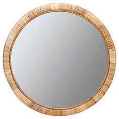 a round mirror made out of bamboo