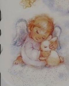 a plate with an angel holding a baby