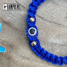 "Beautiful Mexican Handmade Woven \" Blue Evil Eye Symbol\" Unisex bracelet \"Mal de Ojo\" with the company of San Benito Symbol is Handmade braided Design by our Artisan Team to create a beautiful Stylish ,protection and positive accessory , definitely a must have in your religios Collection :) ( One bracelet per order) Color can change slightly depending on the device screen thats been viewed on. Bracelet has and adjustable : One size Fits All Unisex Brazalete Pulcera Tejida a Mano por Artesan Handmade Blue Evil Eye Bracelet For Friendship, Blue Macrame Beaded Bracelets As A Gift, Handmade Blue Evil Eye Bracelet With Round Beads, Handmade Blue Evil Eye Bracelet For Festival, Adjustable Blue Friendship Bracelets With Evil Eye, Bohemian Blue Braided Bracelet With Evil Eye, Handmade Bohemian Blue Evil Eye Bracelet, Handmade Blue Bohemian Evil Eye Bracelet, Blue Macrame Jewelry With Round Beads