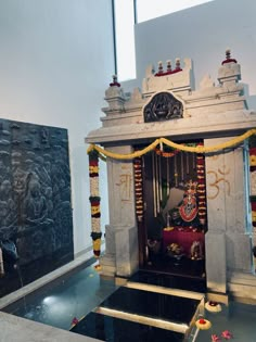 the shrine is decorated with flowers and garlands