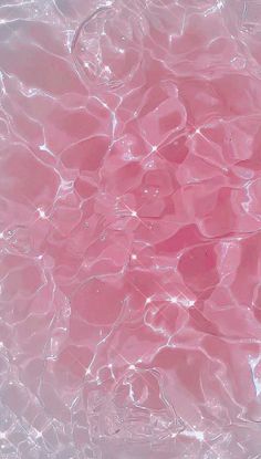 the water is very clear and pink with little ripples on it's surface