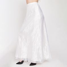 Vintage 80s floor length bridal skirt with a sheer bright white organza shell over a lining layer. Has a back zipper and hook for closure. Originally came with a matching top. Measurements and Condition: Fits like: Labeled size 8, fits modern women's small Fabric: Acetate shell/lining Brand: Unknown, made in USA Condition: Very good, with a 2" and 3" section of extremely faint pink color bleed and a tiny faint brown spot on the lining layer at the lower front left (barely visible through the sheer outer layer). Length: 41" Waist: 26.5" Hips: 38.5" - taken at the bottom of the zipper opening Shown on a 5'8" model with measurements of 35"-26"-38", usually wears a size small to medium. See our FAQ for more info on sizing and condition ratings. Bridal Maxi, Organza Bridal, Bridal Skirt, Bridal Skirts, Wedding Skirt, Top Measurements, Matching Top, Formal Wedding, Label Sizes