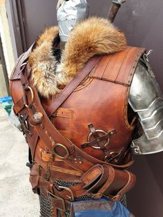 a leather armor with fur collar and hood