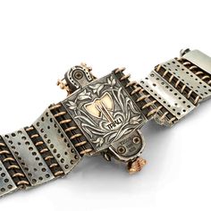 The Ceremonial Horse Bracelet showcases a beautifully handcrafted horse made of sterling silver with an 18K rose gold medieval chamfron, an armor worn by horses in medieval times. The chamfron is adorned with sparkling white diamonds and a central ruby gem. The horse's eyes are crafted from shimmering cabochon sapphires, and its hair is set with champagne colored diamonds. The bracelet is made with sterling silver, champagne diamonds, and 18K rose gold horseshoes, completing the luxurious look o Luxury Elegant Jewelry With Horse Design, Elegant Horse Design Pendant Jewelry, Vintage Silver Jewelry With Horse Design, Elegant Horseshoe-shaped Horse Design Jewelry, Horse Bracelet, Horse Charm Bracelet, Champagne Color, Champagne Diamond, Horse Head