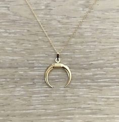 "Solid 14k Gold Double Horn Necklace. ◆ 14k Gold ◆ Chain: 16\" ◆ Horn: 16x15 mm ◆ Made in U.S.A. ◆ Last photo: Just to show the similarity in sizing." Necklace Real Gold, Wide Gold Ring, Tusk Necklace, Minimalist Bangle, Double Horn Necklace, Hammered Gold Ring, Real Gold Necklace, Gold Horns, Hammered Bangles