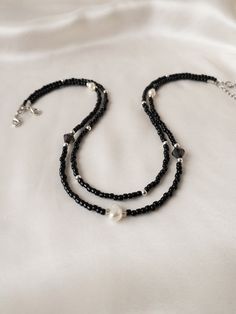 Trendy set of 2 necklaces made of black beads and Pearl beads. Gift for Choker. Elegant necklaces that you can present to yourself or your loved ones on special occasions. Elegant choker necklaces that you can use separately or together are 14 inches and have a 1.5 inch adjustable chain.   *Shipping costs for returns and exchanges belong to the buyer. *There may be some color and tone differences caused by different monitor settings. *It is not recommended to contact the jewelry with water to us Black Double Strand Beaded Necklaces For Jewelry Making, Black Double Strand Necklace With Beads, Black Double Strand Necklace With Black Beads, Adjustable Double Strand Black Beaded Necklace, Chain Shipping, Diy Choker, Elegant Choker, Trend Jewelry, Layered Chokers