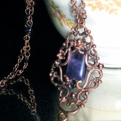 Fluorite Filigree on Beaded Copper Chain. $160.00, via Etsy. Bohemian Amethyst Jewelry With Intricate Design, Handmade Purple Copper Jewelry, Elegant Copper Wire Pendant Jewelry, Hand Forged Amethyst Bronze Jewelry, Elegant Bronze Wire Wrapped Necklaces, Ornate Handmade Purple Jewelry, Antique Handmade Purple Jewelry, Handmade Antique Purple Jewelry, Antique Handmade Amethyst Necklace