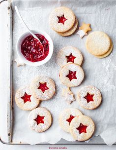 cookies and jam are arranged on a baking sheet