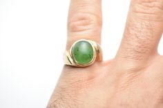 - vintage - tested 10k Gold - green aventurine - stone measures approx: 12mm x 10mm - weighs 4.4 grams - size 8 Green Emerald Oval Cabochon Ring Stamped 14k, Vintage Green Gemstone Signet Ring, Vintage Green Signet Ring With Gemstone, Vintage Green Signet Ring With Polished Finish, Green Oval Cabochon Emerald Ring Collectible, Vintage Oval Untreated Emerald Ring, Vintage Untreated Oval Emerald Ring, Vintage Oval Natural Emerald Ring, Antique Green Signet Ring