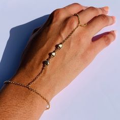 "18 Karat Gold Filled Heart Hand Chain Bracelet length: 7\" + 1.5\" Extension Finger Loop: 4\"  Material: 18 Karat Gold Filled, Hypoallergenic. Tarnish Resistant. Gold-filled does not de-laminate or peel like Gold plated Jewelry nor does it tarnish as readily as silver. Generally speaking, gold filled is better quality and will have a much longer lasting color than plated jewelry. Gold filled jewelry is an excellent option for those who wish to have a product of exceptional quality, beautiful and anti-allergenic, but with prices far lower than solid gold jewelry. We recommend keeping abrasive chemicals away from the jewelry for the items to last. Thank you for visiting and supporting our small business! We hope you will find a stylish piece that speaks to you! ♥ All of our piece our carefu Gold Heart Beads Bracelet For Party, Adjustable Heart-shaped Stainless Steel Charm Bracelet, Adjustable Heart Shape Stainless Steel Charm Bracelet, Adjustable Metal Bracelets For Valentine's Day, Adjustable Heart-shaped Promise Jewelry, Metal Heart Bracelet For Mother's Day, Adjustable Metal Bracelet For Valentine's Day, Heart-shaped Stainless Steel Jewelry For Friendship, Adjustable Metal Heart Bracelet For Valentine's Day