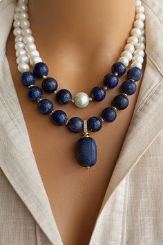 A timeless accessory that embodies natural beauty, our elegant Pearl and Lapis Lazuli Necklace combines lustrous freshwater pearls, known for their lustrous and iridescent appeal, with the deep blue appeal of genuine Lapis Lazuli gemstones. Handmade with love and attention to detail, this stunning necklace exudes a sense of opulence and elegance. Elegant Pearl Necklace With Polished Beads As Gift, Formal Lapis Lazuli Necklace With Round Beads, Elegant Round Lapis Lazuli Beaded Necklaces, Formal Lapis Lazuli Beaded Necklace, Elegant Beaded Necklaces With Stones For Gift, Elegant Round Beaded Lapis Lazuli Necklace, Elegant Round Lapis Lazuli Beaded Necklace, Elegant Stone Necklace For Anniversary, Elegant Lapis Lazuli Beaded Necklaces With Round Beads