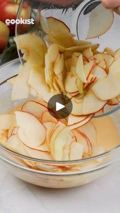 an image of apples being sliced in a bowl