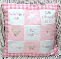 a pink and white checkered pillow on a wicker chair with the names of babies