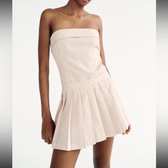 Such A Cutie Dress! So Many Things To Do With It White Tights! Or Edgy Black Chunky Boots Or Cute And Dainty White Heels. Says Pale Pink Color But I Think It’s A Light Beige And White! Ships Same Day Summer Pleated Strapless Mini Dress, Spring Pleated Strapless Mini Dress, Beige Stretch Mini Dress For Summer, Spring Strapless Dress With Straight Neckline And Stretch, Fitted Beige Strapless Dress For Summer, Chic Stretch Strapless Dress, Chic Strapless Pleated Mini Dress, Chic Pleated Strapless Dress For Summer, Summer Beige Pleated Mini Dress