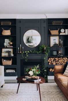 a living room filled with furniture and a fire place