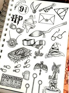 an open notebook with drawings on it and the words harry potter written in black ink