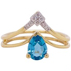 This Gabriel & Co. designer ring is stunningly beautiful with a pear shaped blue topaz set in polished 14k yellow gold dripping with diamonds provides a look that is very modern and classic at the same time! This ring is very fashionable and can add a touch of style to any outfit, yet it is also classy enough to pair easily with formal wear. It looks great by itself but also looks wonderful in a stack! This ring would be the perfect gift for yourself or your loved one! The details for this beaut Blue Topaz Gemstone, Number 8, Star Jewelry, Blue Topaz Ring, Blue Gemstones, Topaz Gemstone, Diamond Shape, Topaz Ring, Diamond Clarity