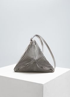 ISSEY MIYAKE - Meteorite Bag. Made in Japan #silverbag #triangular #triangle #handbag #silver #lines #inspiration #trend #mood #meteorite #angular #metal #Zippered #zipclosure #metallic #silverpleats #pleats #wristletstyle #shoulderstrap #silverleather #leatherbag #brand #highfashion #colour Issey Miyake Bag, Silver Bags, Slip On Espadrilles, Clutches For Women, Classy And Fabulous, Issey Miyake, Made In Japan, Bucket Bag, Apparel Accessories