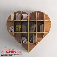 a wooden heart shaped shelf with books on it's sides and shelves in the shape of a bookcase