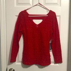 This Jennifer Lopez Brand Shirt Is Really Very Beautiful In Person. It’s Red, And Almost Looks Like A Sweater, But It’s Not. It Had Some Texture On It, And A Few Sequins To Give It A Nice Shimmer. The Back Also Has A Cute Detail (Pictured). Perfect For A Casual At-Home Valentine’s Day! Pair With A Black Skirt, Or Some Cute Jeans. Red Holiday Tops For Fall, Red Tops For Holiday In Fall, Red Tops For Fall Holiday, Red Tops For Holiday And Fall Season, Stretch Long Sleeve Tops For Festive Occasions, Festive Long Sleeve Stretch Tops, Fitted Long Sleeve Tops For Holiday, Red Winter Blouse For Party, Red Winter Party Blouse