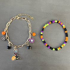 This Is A Two Stretch Bracelet Set That Includes: 1) Black Cat With A Wizard Witch Hat & Jack-O'-Lantern Pumpkin Metal Enamel Pendant Paper Clip Chain Bracelet. Bracelet Has Orange & Black Faceted Beads As Well As Spider And Candy Corn Beads 2) Black, Green, Purple, And Orange Bead Stretch Bracelet Many Other Halloween Themed Bracelet Sets As Well As Jewelry, Headbands, And Hair Accessories Available In Boutique. Join My Live Shows On Wednesday And Sunday At 5 Pm Pacific To See Unique Accessorie Halloween Bead Bracelet Ideas, Halloween Beaded Bracelet, Halloween Bracelet Ideas, Fall Bracelets, Halloween Beaded Jewelry, Corn Bead, Purple Lantern, Halloween Charm Bracelet, Black Cat Pumpkin