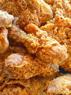 fried chicken is piled on top of each other