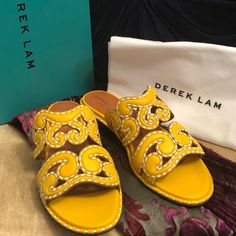 Brand New, Unworn Gorgeous Yellow Slip-On Sandal Mules From Luxury Designer Derek Lam. These Are Sold Out Everywhere And Very Rare. Features Gorgeous Deep Yellow Gold Leather With Swirl Cutouts And Prominent Contrast White Stitching. These Are Stunning And The Craftsmanship Is Exquisite. Comes With Original Box And Shoe Bag, Pictured. Gold Yellow Color, Rare Features, Deep Yellow, Embellished Sandals, Derek Lam, Gold Leather, Gold Yellow, Luxury Designer, Yellow Color