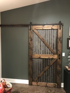 an open barn door in the corner of a room