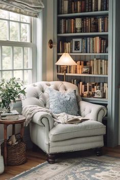 a chair in front of a book shelf filled with books