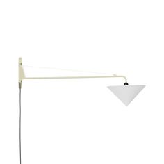 a white floor lamp sitting on top of a table