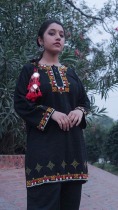 Autumn inspired  Hand crafted black khadar street wear kurta with traditional Sindhi embroidery, mirror work borders and kasuti embroidery butees.  For size guide please refer to the last few images.  The other items visible in the images would be available soon. For custom orders or if the product is sold out or you would want something bespoke, leave a message. Bohemian Style Dabka Kurta For Designer Wear, Eid Kurta With Multicolor Embroidery And Mirror Work, Designer Wear Tunic Kurta With Mirror Work, Straight Kurta With Resham Embroidery For Rituals, Bohemian Kurta With Mirror Work For Eid, Designer Wear Mirror Work Kurta Tunic, Unstitched Bohemian Kurta With Mirror Work, Resham Embroidery Straight Kurta For Rituals, Unstitched Ceremonial Kurta With Mirror Work