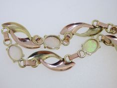 "This stunning little vintage treasure is set in 10K yellow & rose gold and features 3 genuine cabochon cut colorful opals. The bracelet measures approx. 5/16\" wide x 7-1/4\" long. Total weight is 9.7 grams. (T3 * MJP059173) Please review all photos before purchasing and feel free to ask questions about the item :) We are sorry but we do NOT offer INTERNATIONAL SHIPPING! Payment due upon checkout to avoid shipping delays and loss of purchased item. Payment's not made within 72 hours will re Diamond Wedding Sets, Engagement Sets, Lapis Lazuli Ring, Opal Bracelet, 72 Hours, Photo Bracelet, Emerald Diamond, Yellow Roses, Yellow Rose