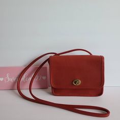 "Vintage Coach Red leather with brass hardware Roomy interior with front pocket covered by a flap and secured by a turnlock Attached strap drop 22\" Measures: 7\"L, 6\"H, 1.5\"W Made in New York City, USA #097-7606 Flaw: slight discoloration on top bend Cleaned, conditioned and ready to wear! Questions? Just ask More vtg Coach styles/colors also available G92" Coach Vintage Handbags, Side Purses, Rose Gold Accessories, Crossbody Saddle Bag, Vintage Coach Bags, Red Purses, Vintage Purse, Purses Designer, Coach Leather