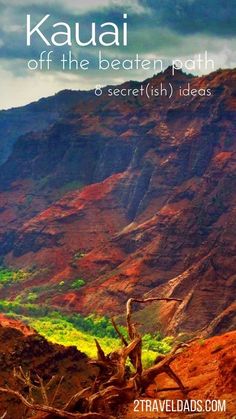 the mountains are covered in green and red foliage, with text that reads kauai off