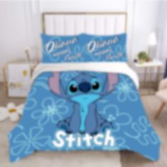 this is an image of a blue bed with stitch on it