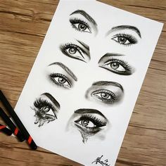 pencil drawings of different eyes and lashes on paper with black marker pens next to them