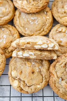 cookies with white sugar on top are cooling on a rack